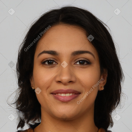 Joyful latino young-adult female with medium  brown hair and brown eyes