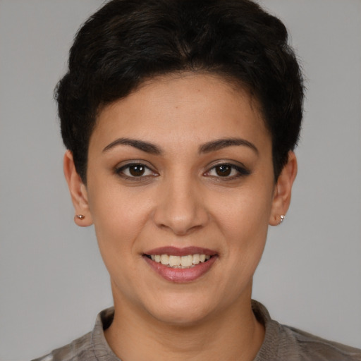 Joyful white young-adult female with short  brown hair and brown eyes
