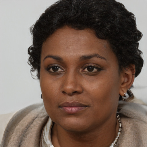 Neutral black young-adult female with short  brown hair and brown eyes