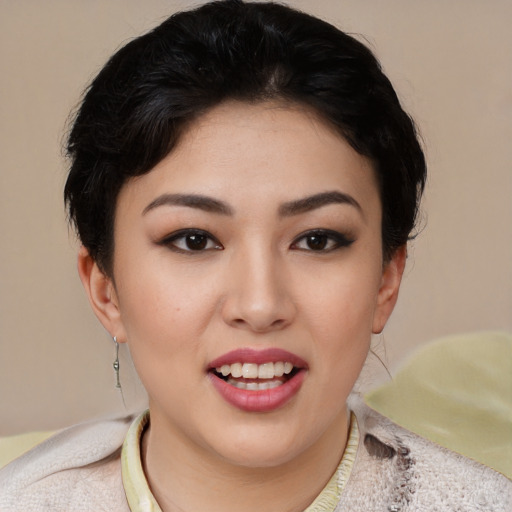 Joyful asian young-adult female with short  black hair and brown eyes