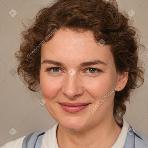 Joyful white adult female with medium  brown hair and blue eyes