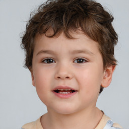 Joyful white child male with short  brown hair and brown eyes