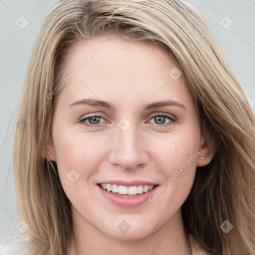 Joyful white young-adult female with long  brown hair and blue eyes