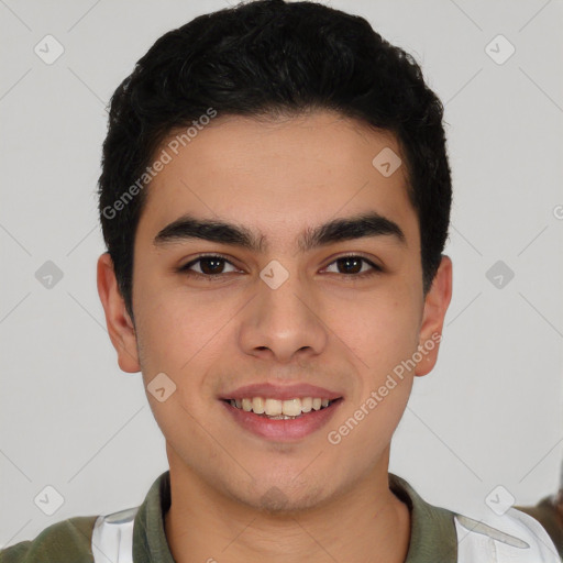 Joyful latino young-adult male with short  black hair and brown eyes