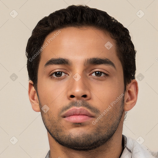 Neutral latino young-adult male with short  black hair and brown eyes