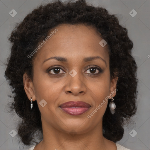 Joyful black adult female with medium  brown hair and brown eyes