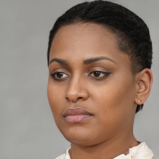 Neutral black young-adult female with short  brown hair and brown eyes