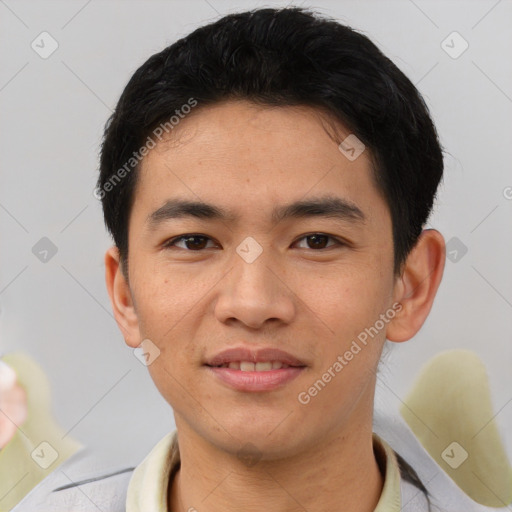 Joyful asian young-adult male with short  black hair and brown eyes