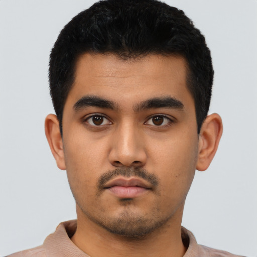 Neutral latino young-adult male with short  black hair and brown eyes