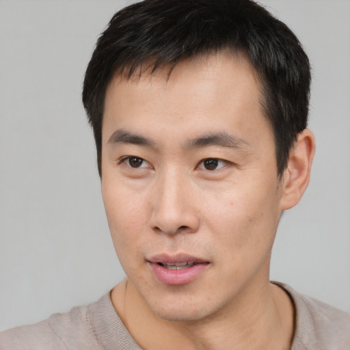 Neutral asian young-adult male with short  brown hair and brown eyes