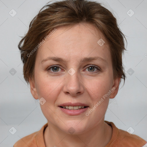 Joyful white adult female with medium  brown hair and grey eyes