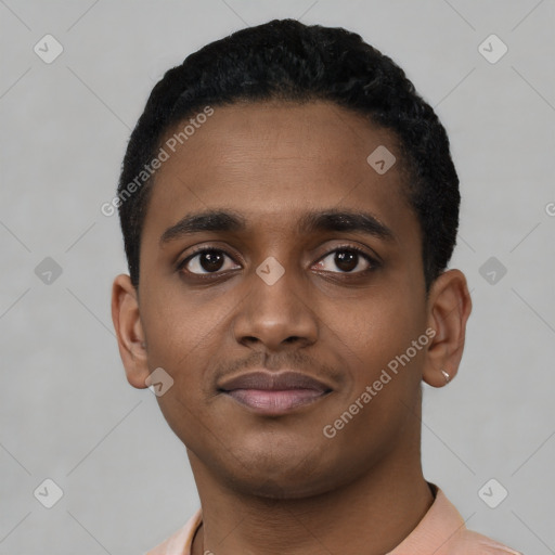 Joyful black young-adult male with short  black hair and brown eyes