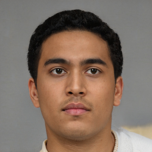 Neutral latino young-adult male with short  black hair and brown eyes
