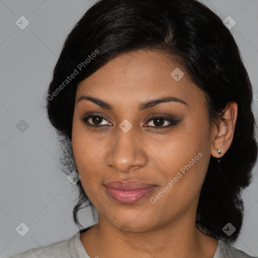 Joyful black young-adult female with medium  brown hair and brown eyes