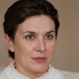 Joyful white adult female with short  brown hair and brown eyes