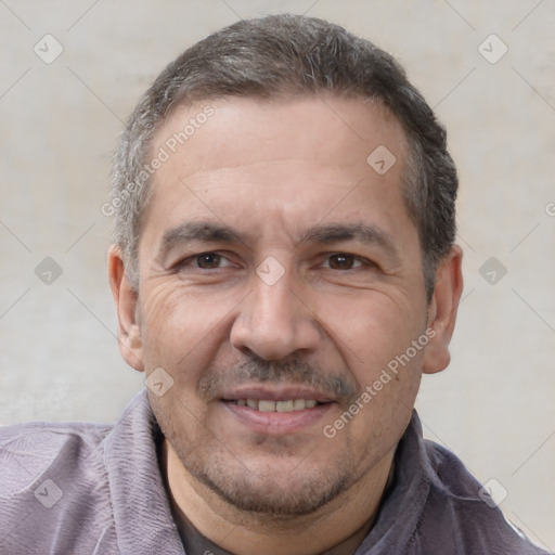 Joyful white adult male with short  black hair and brown eyes