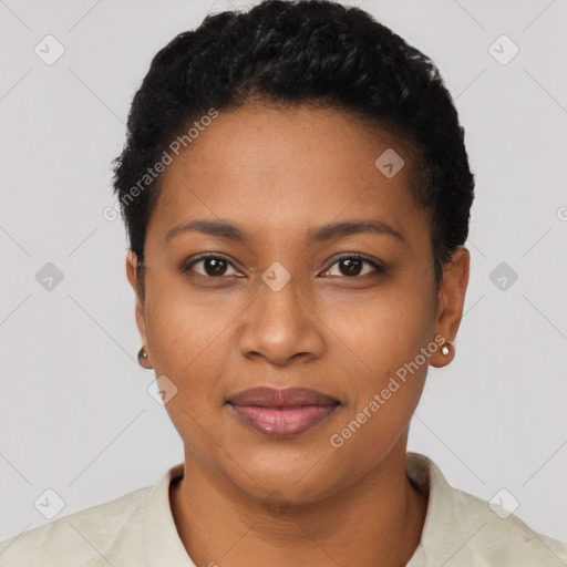 Joyful black young-adult female with short  black hair and brown eyes