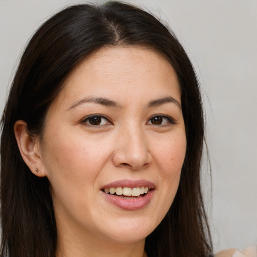 Joyful white young-adult female with long  brown hair and brown eyes