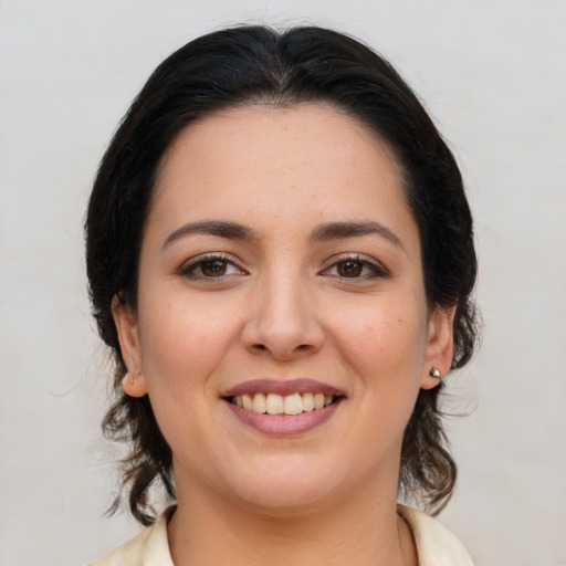 Joyful white young-adult female with medium  brown hair and brown eyes