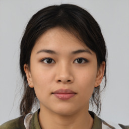 Neutral asian young-adult female with medium  brown hair and brown eyes