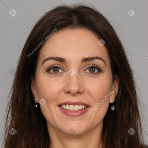 Joyful white adult female with long  brown hair and brown eyes