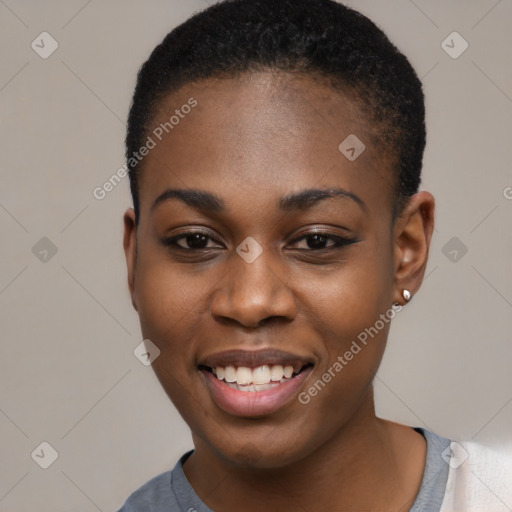 Joyful black young-adult female with short  black hair and brown eyes