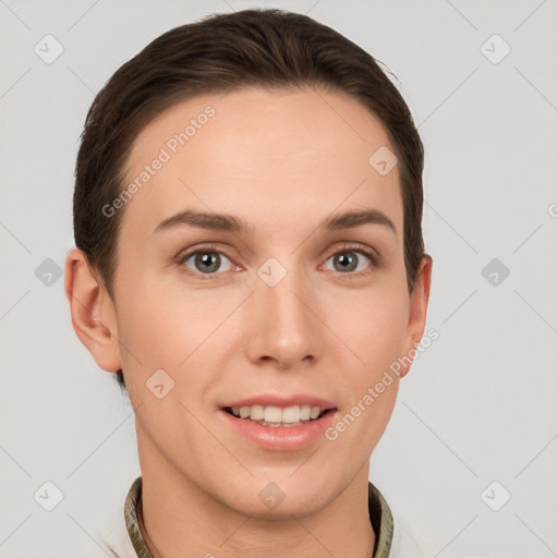 Joyful white young-adult female with short  brown hair and grey eyes