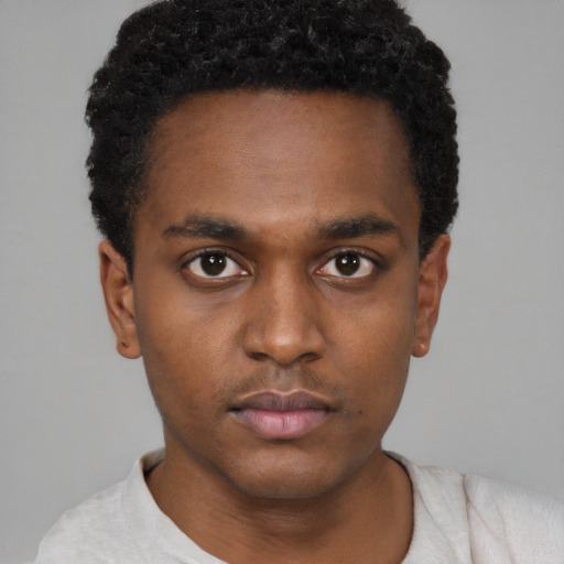 Neutral latino young-adult male with short  brown hair and brown eyes