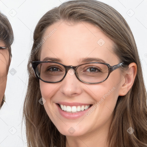 Joyful white young-adult female with long  brown hair and blue eyes