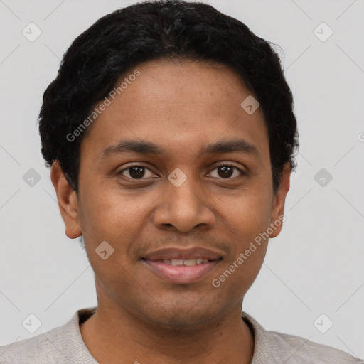 Joyful black young-adult male with short  black hair and brown eyes