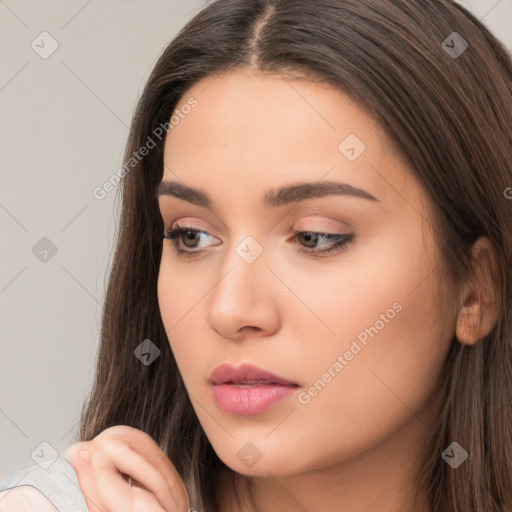 Neutral white young-adult female with long  brown hair and brown eyes