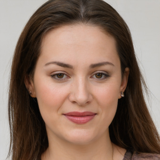 Joyful white young-adult female with long  brown hair and grey eyes