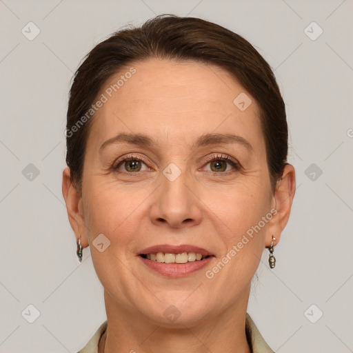 Joyful white adult female with short  brown hair and brown eyes