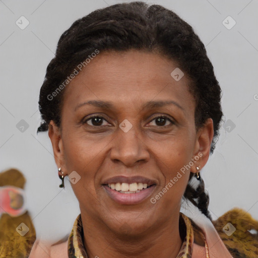 Joyful black adult female with short  brown hair and brown eyes