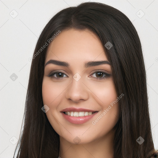 Joyful white young-adult female with long  black hair and brown eyes