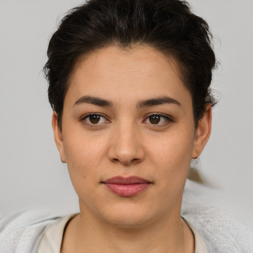 Joyful asian young-adult female with short  brown hair and brown eyes