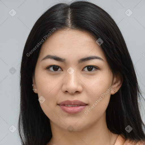 Joyful asian young-adult female with long  brown hair and brown eyes