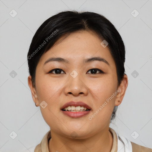 Joyful asian young-adult female with short  brown hair and brown eyes