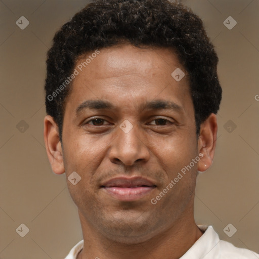 Joyful latino young-adult male with short  brown hair and brown eyes