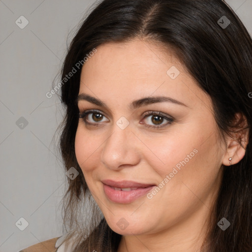 Joyful white young-adult female with long  brown hair and brown eyes