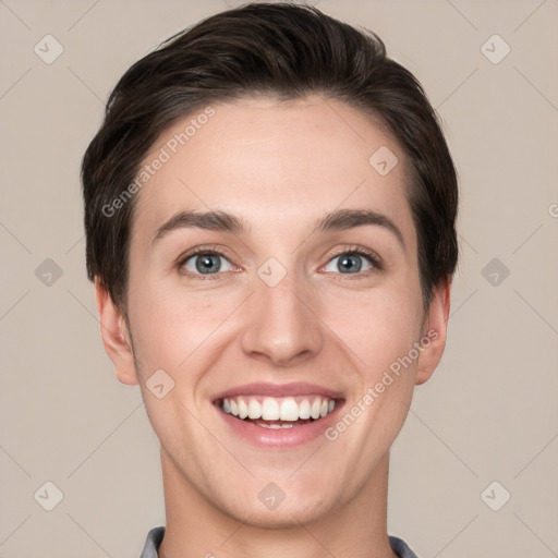 Joyful white young-adult female with short  brown hair and grey eyes