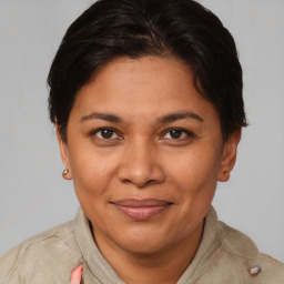 Joyful white adult female with short  brown hair and brown eyes