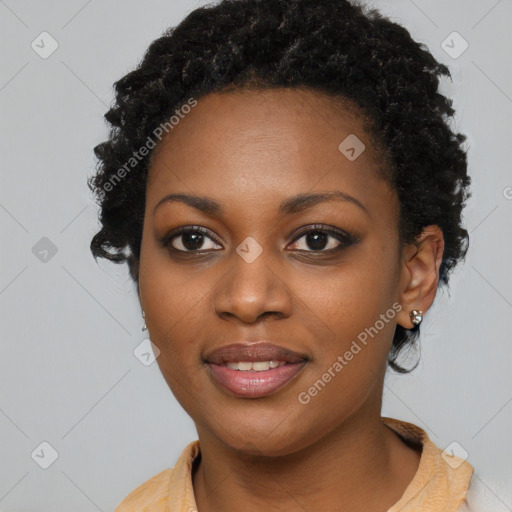 Joyful black young-adult female with medium  black hair and brown eyes