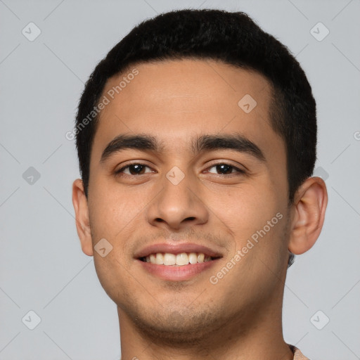 Joyful latino young-adult male with short  brown hair and brown eyes