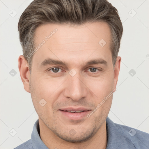 Joyful white adult male with short  brown hair and brown eyes