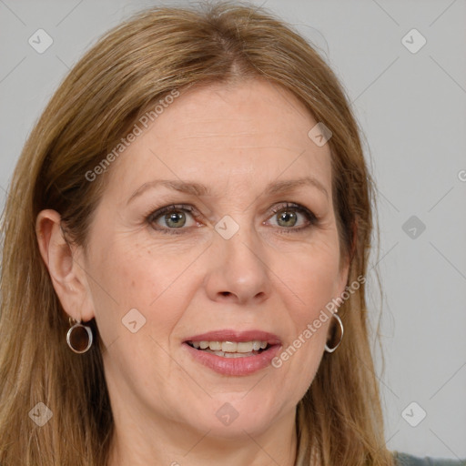 Joyful white adult female with long  brown hair and brown eyes