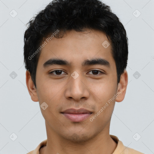 Joyful latino young-adult male with short  brown hair and brown eyes