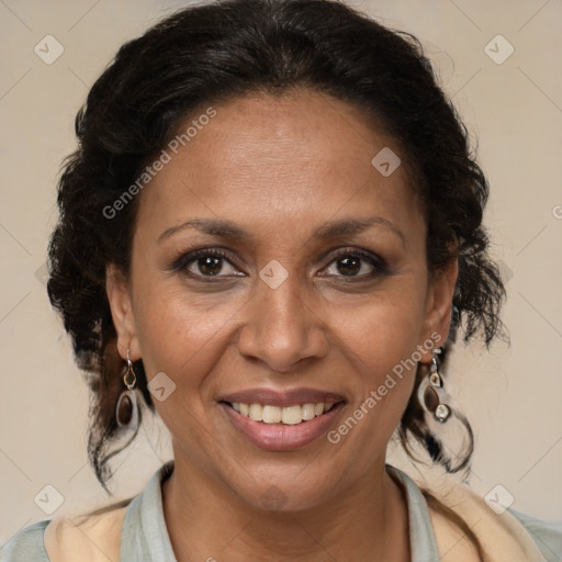 Joyful latino adult female with medium  brown hair and brown eyes