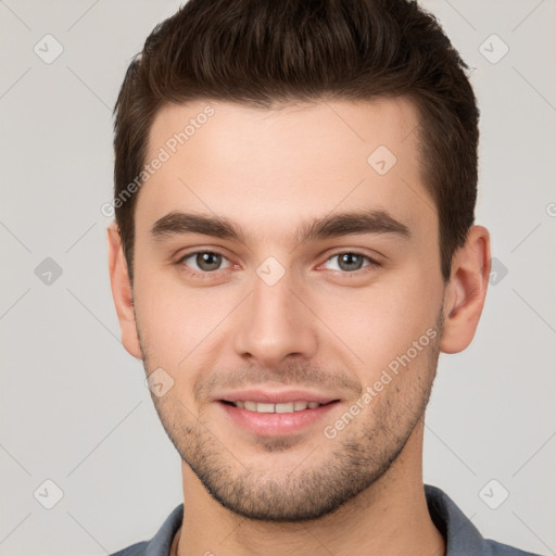 Joyful white young-adult male with short  brown hair and brown eyes