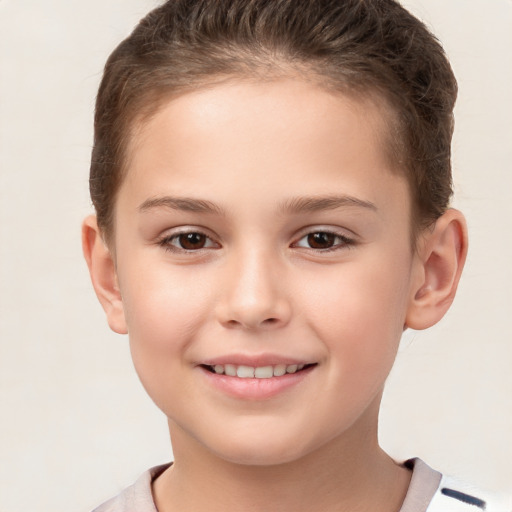 Joyful white child female with short  brown hair and brown eyes